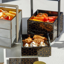 Luxury bento plates for hotel food amenities in black and gold