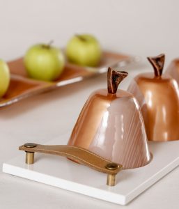 Marble accent tray with turndown amenities on a luxury hotel bedside MyGlassStudio
